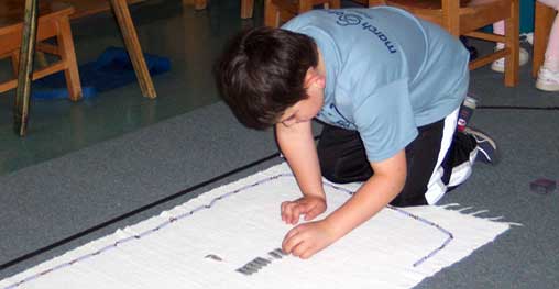 child working with beads